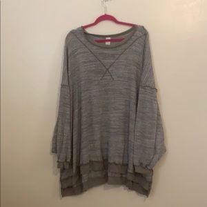 Greenish grey loose fitting waffle weave sweater.